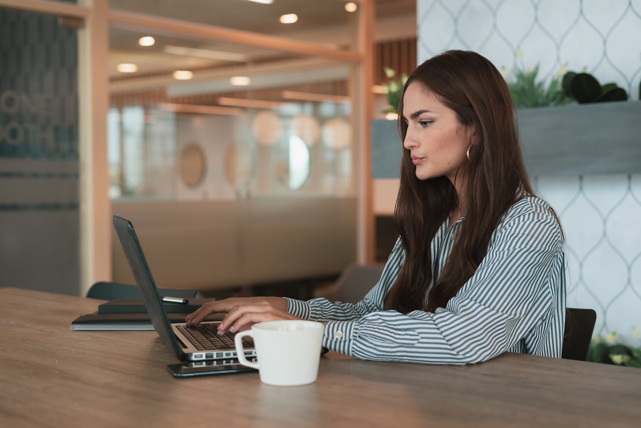 Woman focused on deep work at office desk